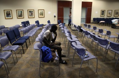 A young man waits to be processed into the temporary shelter located at the Lakewood Church on August 29th, 2017, in Houston, Texas.