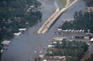 A road is covered by floodwater left in the wake of Hurricane and Tropical Storm Harvey on August 31st, 2017, near Houston, Texas.