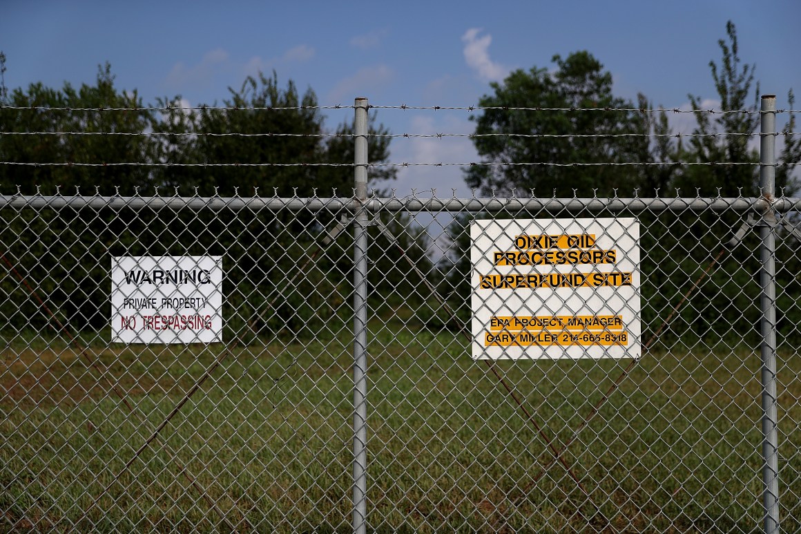 A sign is posted on a fence at the Dixie Oil Processors Superfund site on September 4th, 2017, in Friendswood, Texas.