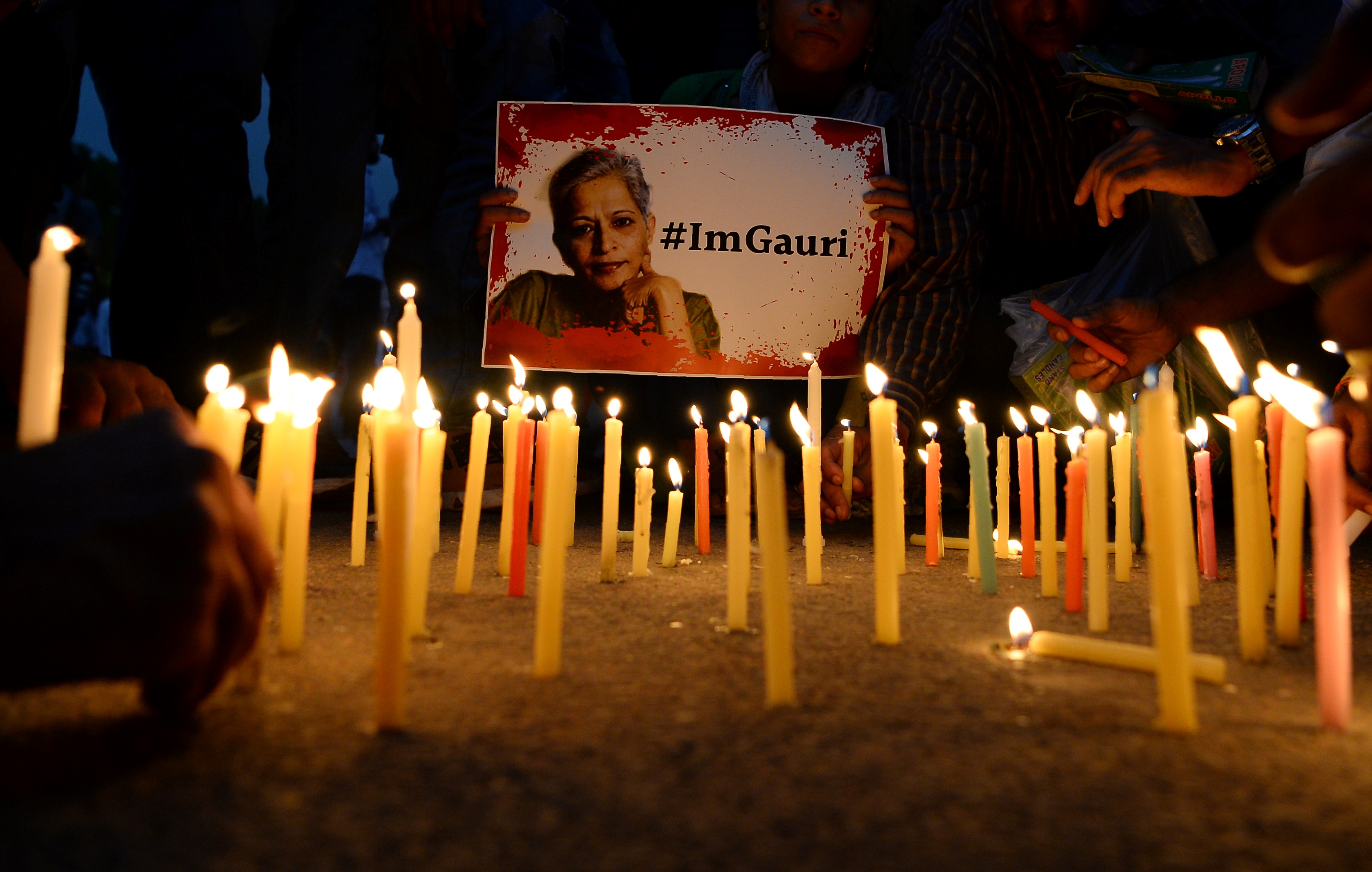 Indian activists take part in a protest rally against the killing of Indian journalist Gauri Lankesh at the India Gate memorial in New Delhi on September 6th, 2017. Indian activists, politicians, and journalists demanded a full investigation into the murder of Gauri Lankesh, a newspaper editor and outspoken critic of the ruling Hindu nationalist party whose death has sent shockwaves across the country.