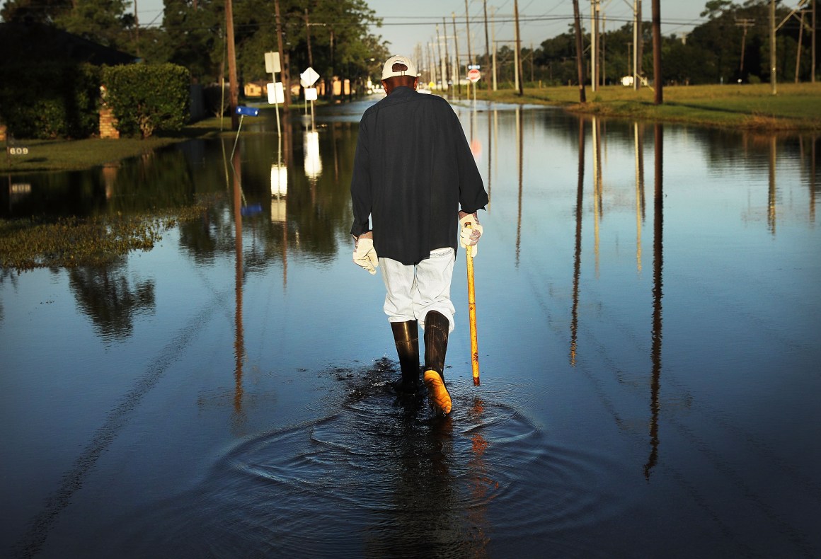 Paul Morris checks on neighbor's homes in a flooded district of Orange as Texas slowly moves toward recovery from the devastation of Hurricane Harvey on September 7th, 2017.