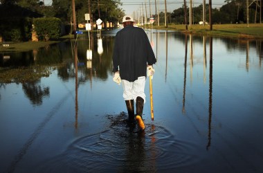 Paul Morris checks on neighbor's homes in a flooded district of Orange as Texas slowly moves toward recovery from the devastation of Hurricane Harvey on September 7th, 2017.