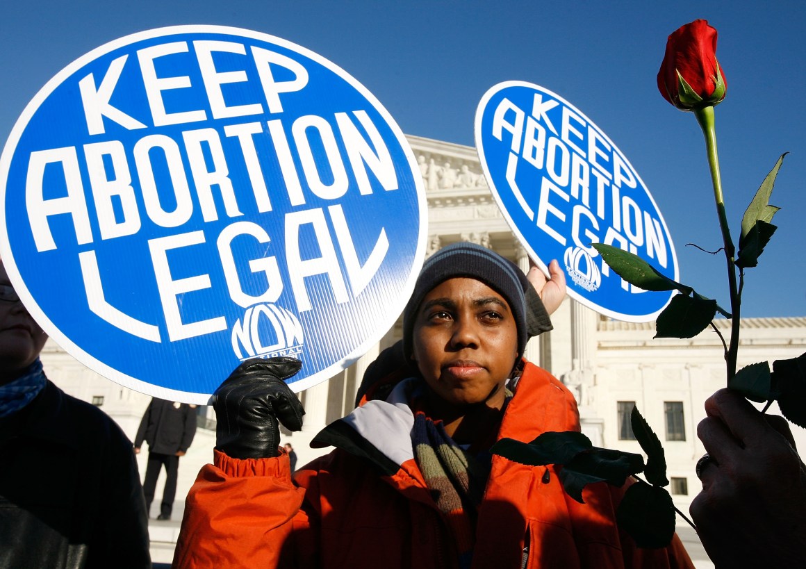 A pro-choice activist holds a sign in front of the U.S. Supreme Court on January 22nd, 2009, in Washington, D.C.