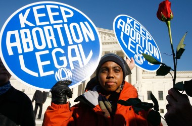 A pro-choice activist holds a sign in front of the U.S. Supreme Court on January 22nd, 2009, in Washington, D.C.