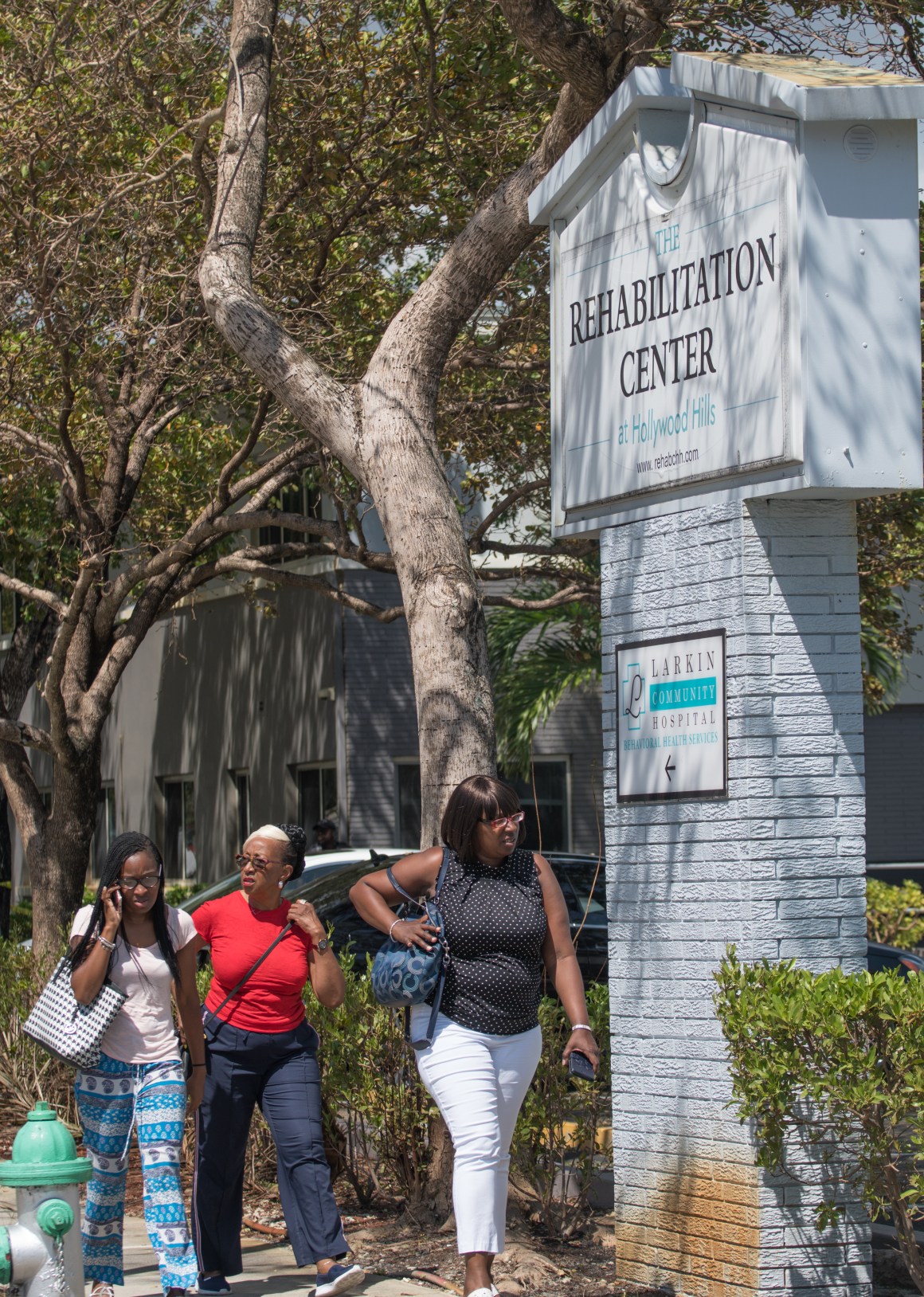 Three women who said they were employees of a rehabilitation center where six patients were found dead after Hurricane Irma leave the center on September 13th, 2017, in Hollywood, Florida.