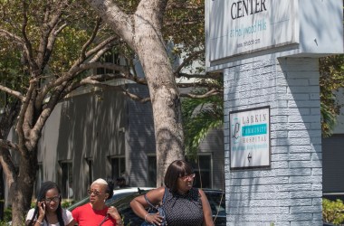 Three women who said they were employees of a rehabilitation center where six patients were found dead after Hurricane Irma leave the center on September 13th, 2017, in Hollywood, Florida.