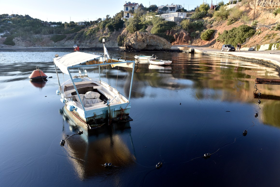 A boat floats on polluted water on the coast of Salamis Island on September 13th, 2017, in Salamis, Greece. The small tanker, Agia Zoni II, sank on September 10th while anchored off the coast of Salamis, near Greece's main port of Piraeus. It was carrying a cargo of 2,200 tons of fuel oil and 370 tons of marine gas oil. Salamis Island has suffered heavy pollution as a result, in what has been called a "major environmental disaster" by officials.