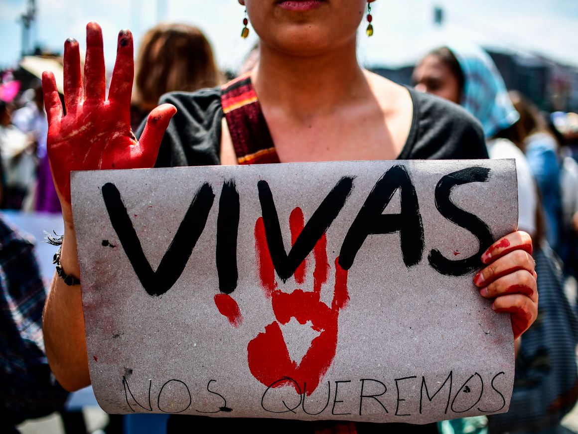 A Mexican woman holding a sign reading "We want us alive" takes part in a protest against murders and other violence toward women in Mexico City on September 17th, 2017.