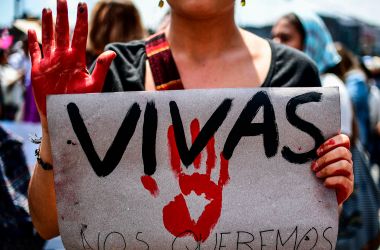 A Mexican woman holding a sign reading "We want us alive" takes part in a protest against murders and other violence toward women in Mexico City on September 17th, 2017.