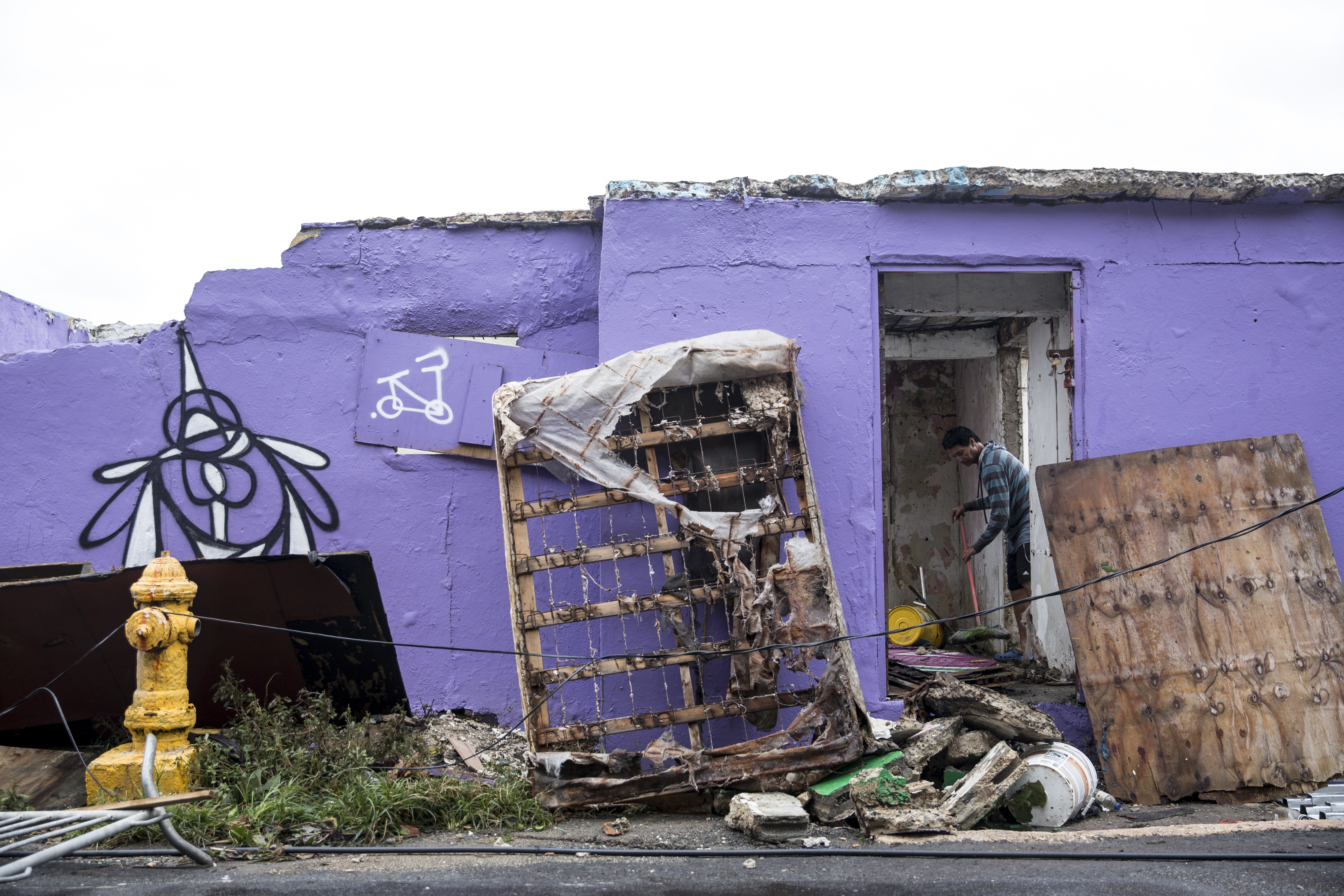 Homeowners clear rubble in the La Perla neighborhood of San Juan on September 21st, 2017.