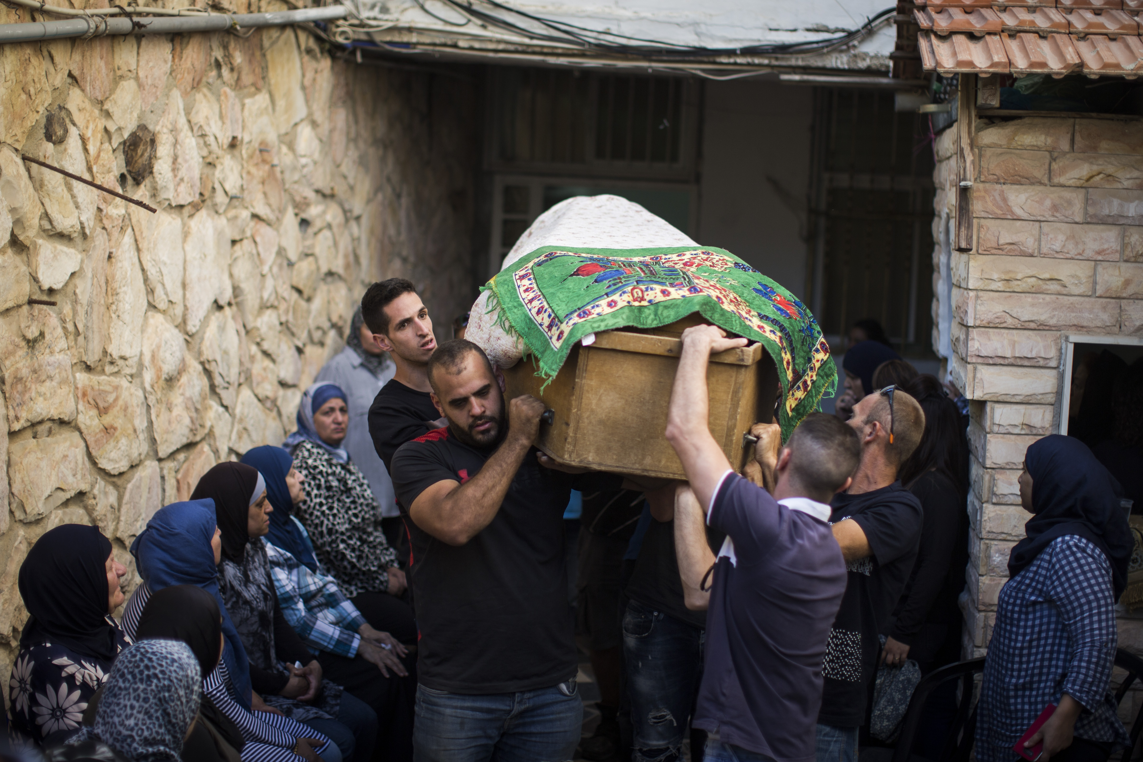 Friends and family carry Yosef Othman's coffin on September 26th, 2017, in Jerusalem, Israel, at the funeral for one of three guards killed during an attack at a West Bank settlement.