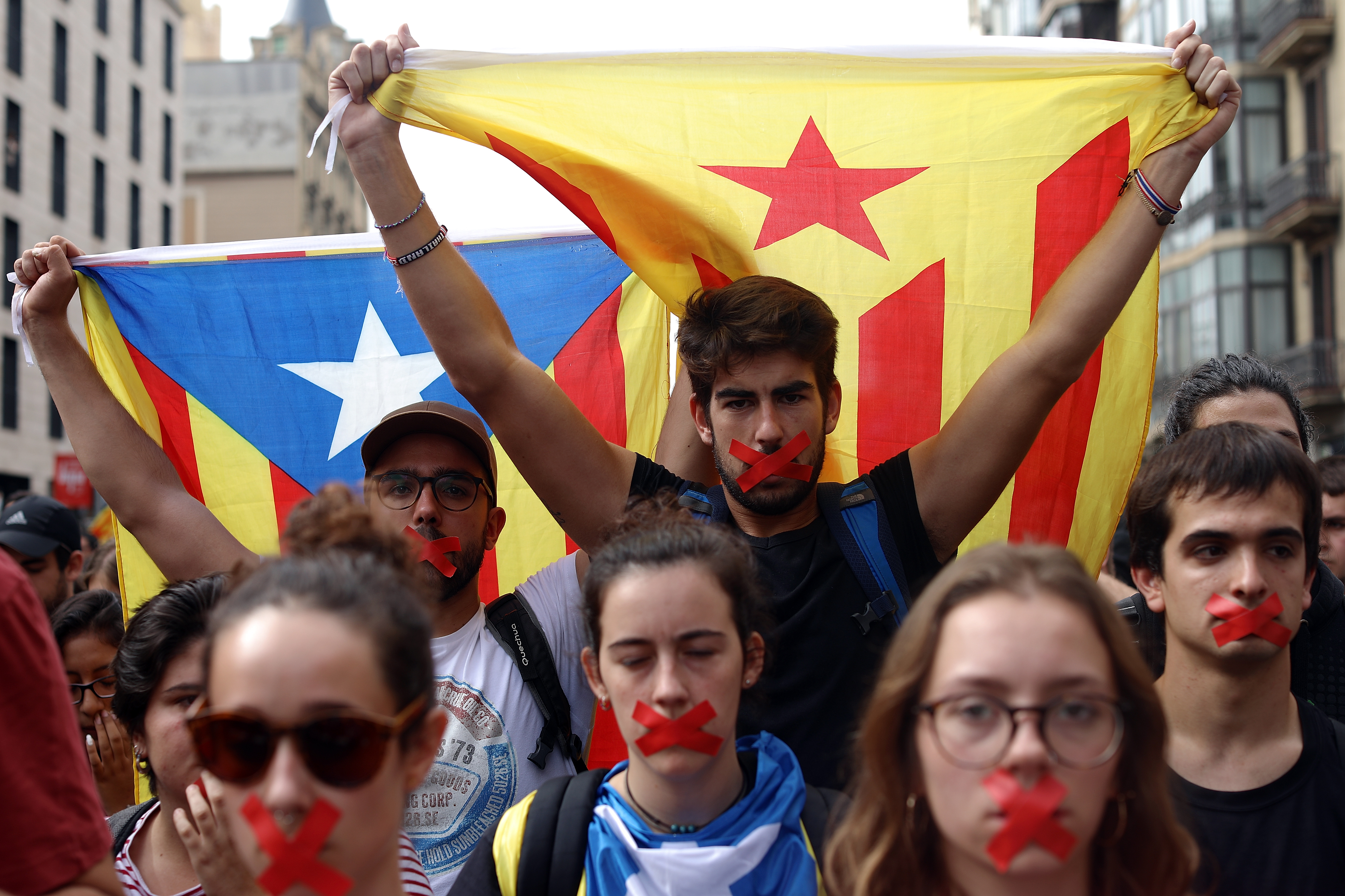 Students hold a silent protest against the violence that marred Catalonia's referendum vote on October 2nd, 2017, in Barcelona, Spain.