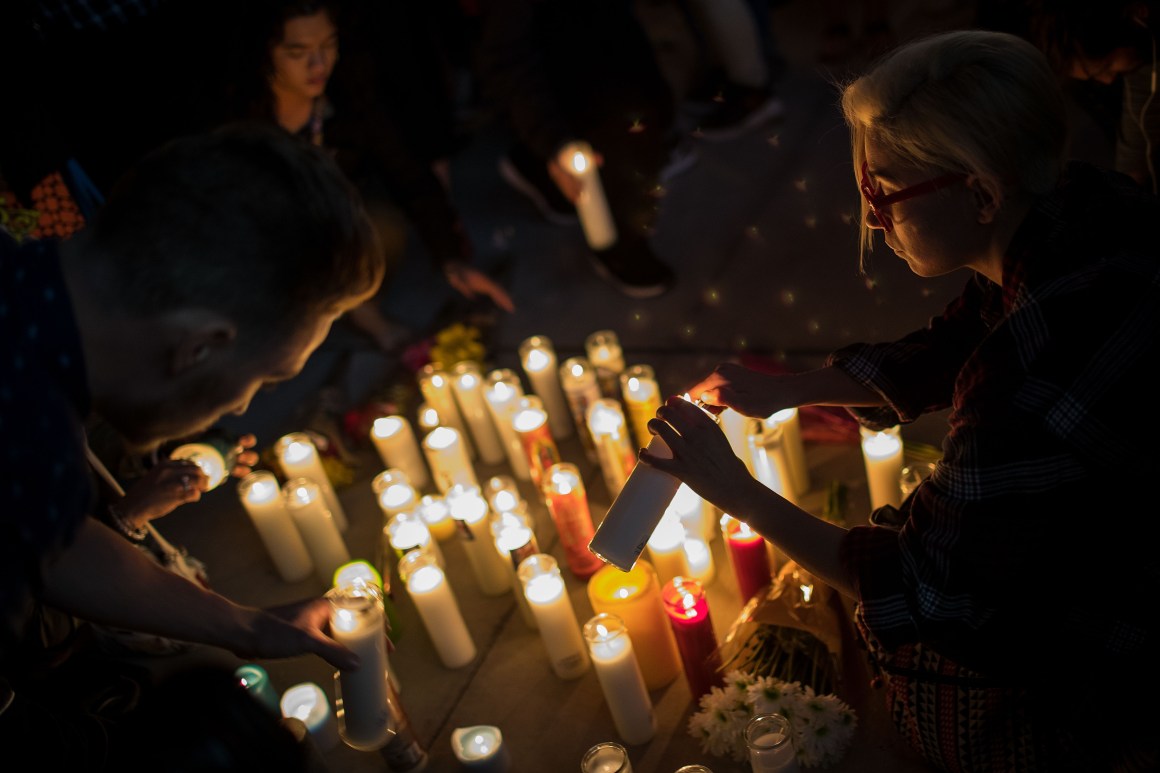 Mourners light candles during a vigil in Las Vegas, Nevada, held on October 2nd, 2017.