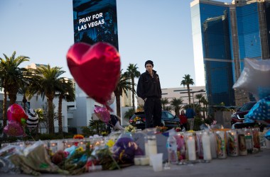 Matthew Helms, who worked as a medic the night of the shooting, visits a makeshift memorial for the victims of Sunday night's mass shooting on the north end of the Las Vegas Strip on October 3rd, 2017, in Las Vegas, Nevada.