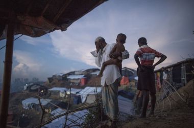 Rohingya Muslim refugees look at the hundreds of tents filling a refugee camp in Bangladesh's Ukhiya district on October 4th, 2017.