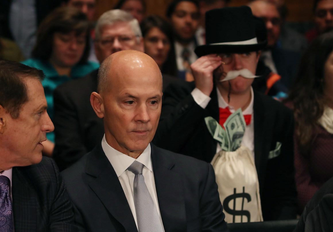 Former Equifax Chief Executive Officer Richard Smith prepares to testify before the Senate Banking, Housing and Urban Affairs Committee.