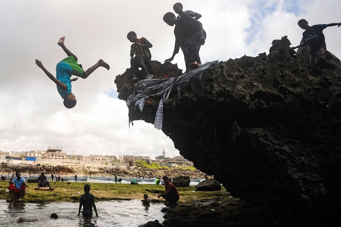 Somali children dive, play, and swim on the seashore of Hamarweyne district in Mogadishu, Somalia, on October 6th, 2017.