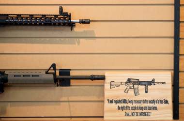 A placard about gun rights hangs on the wall next to assault rifles for sale at Blue Ridge Arsenal in Chantilly, Virginia, on October 6th, 2017.