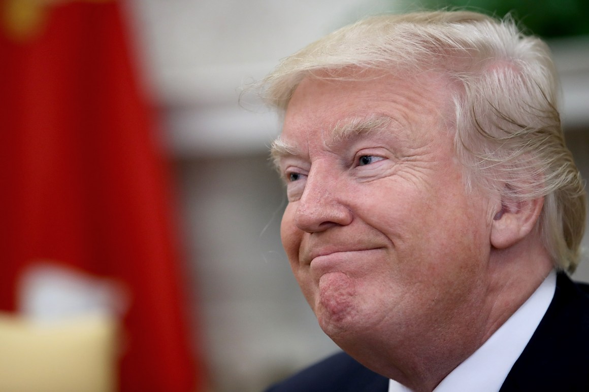 U.S. President Donald Trump answers questions from the press during a meeting with former U.S. Secretary of State Henry Kissinger in the Oval Office on October 10th, 2017, in Washington, D.C.