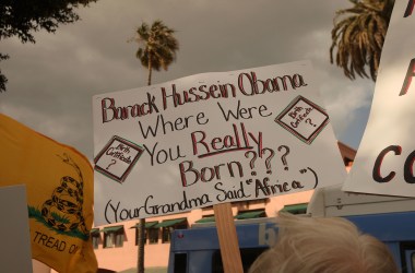 A demonstrator questions the citizenship of President Barack Obama at an American Family Association-sponsored protest against taxes and economic stimulus spending on April 15th, 2009, in Santa Monica, California.