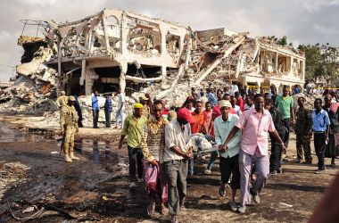 Somali men carry the body of a victim who died in the explosion of a truck bomb in the center of Mogadishu, on October 15th, 2017.