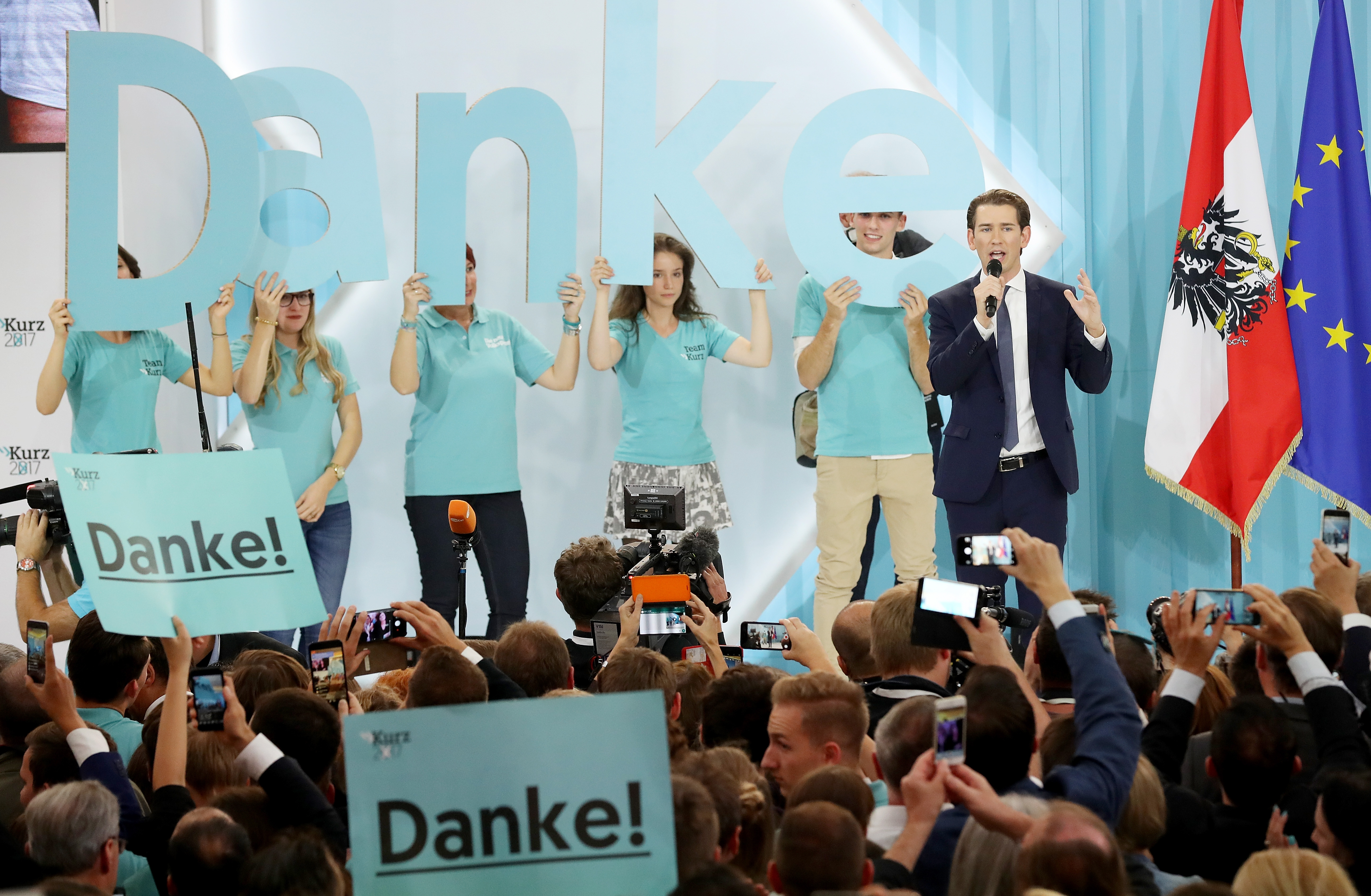 Sebastian Kurz (R), Austrian foreign minister and leader of the conservative Austrian People's Party, speaks to supporters after initial results give the party a first place finish and 31.4 percent of the vote in Austrian parliamentary elections on October 15th, 2017, in Vienna, Austria.