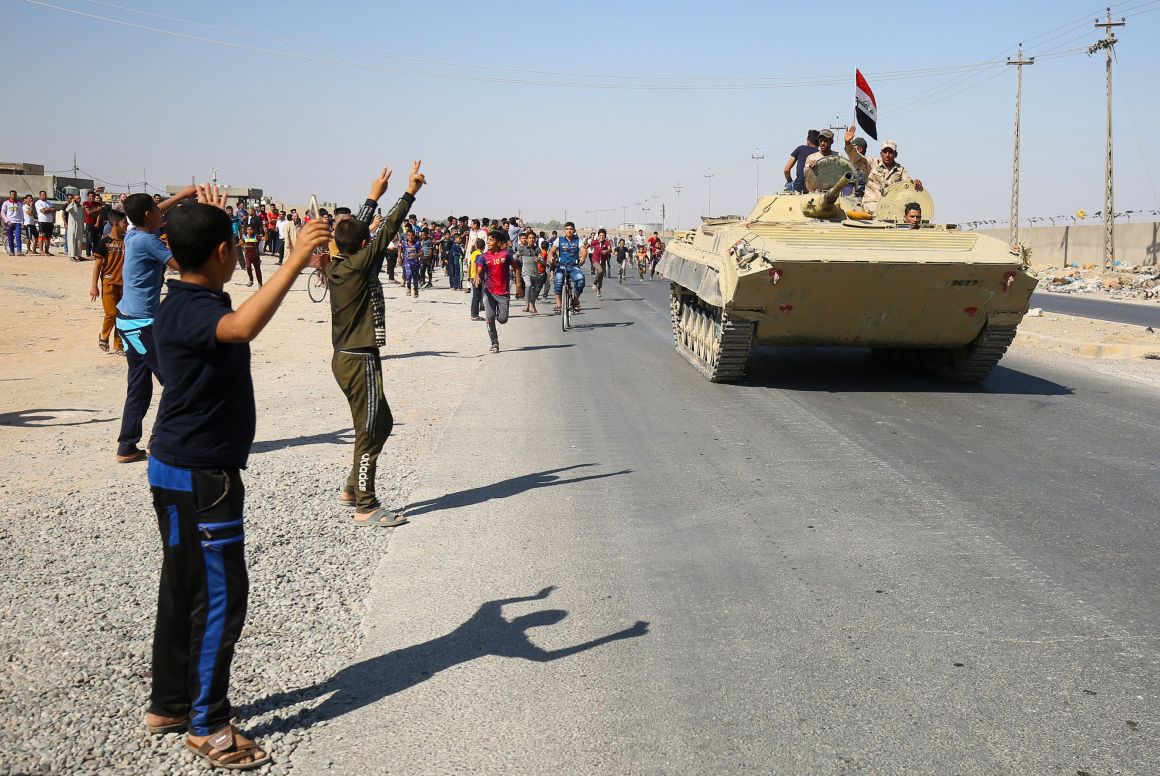 Iraqi forces arrive in the southern outskirts of Kirkuk on October 16th, 2017. Government troops clashed with Kurdish fighters Monday near the disputed city, seizing a military base and oil fields in a major operation sparked by a controversial independence referendum.