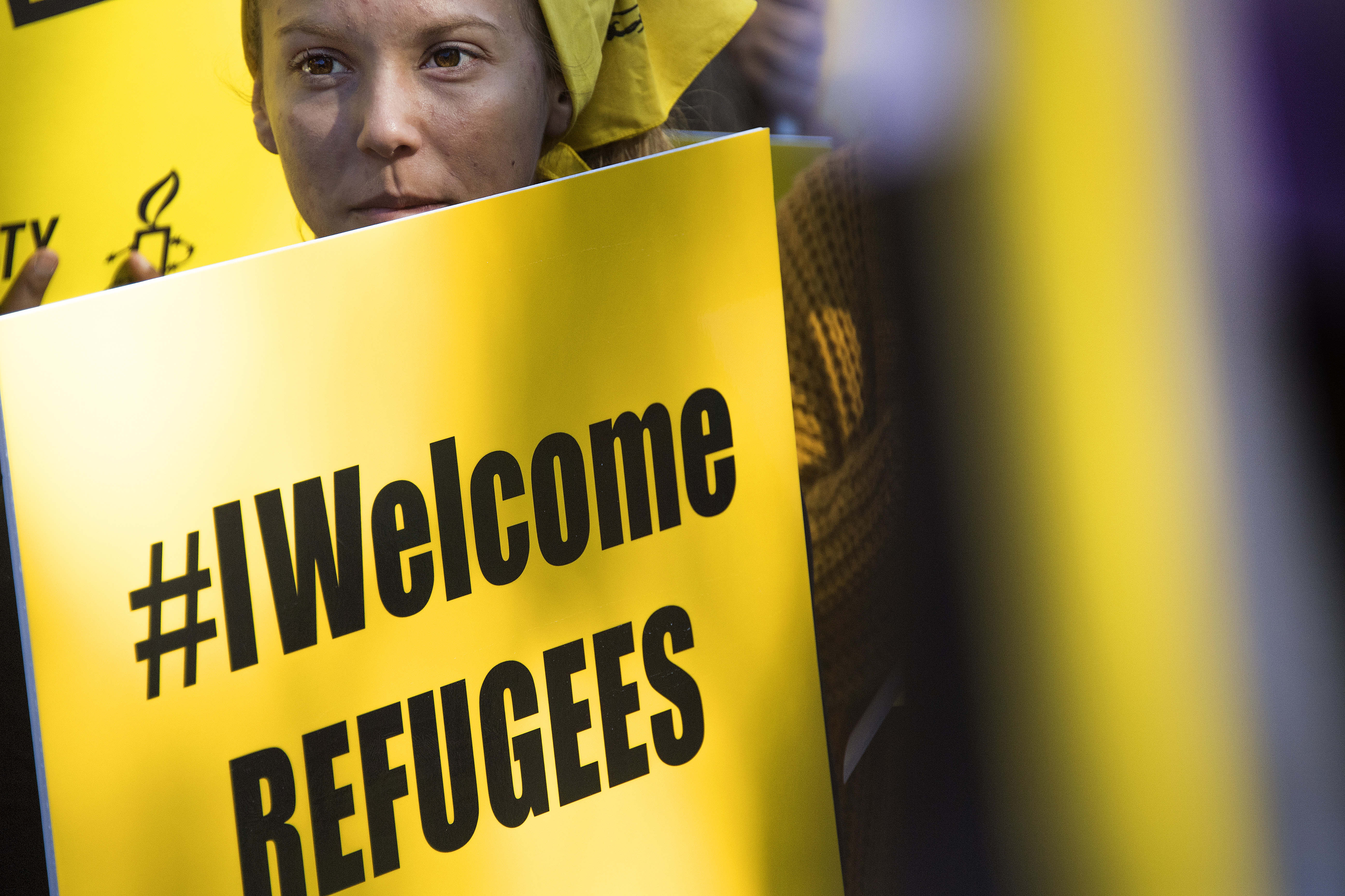 A demonstrator holds a placard during a protest against discriminatory immigration policies in Washington, D.C., on October 18th, 2017.