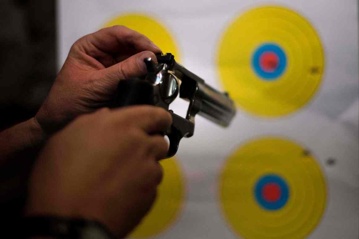 A man adjusts the sights on his .357 revolver at the Lynchburg Arms & Indoor Shooting Range in Lynchburg, Virginia, on October 20th, 2017.