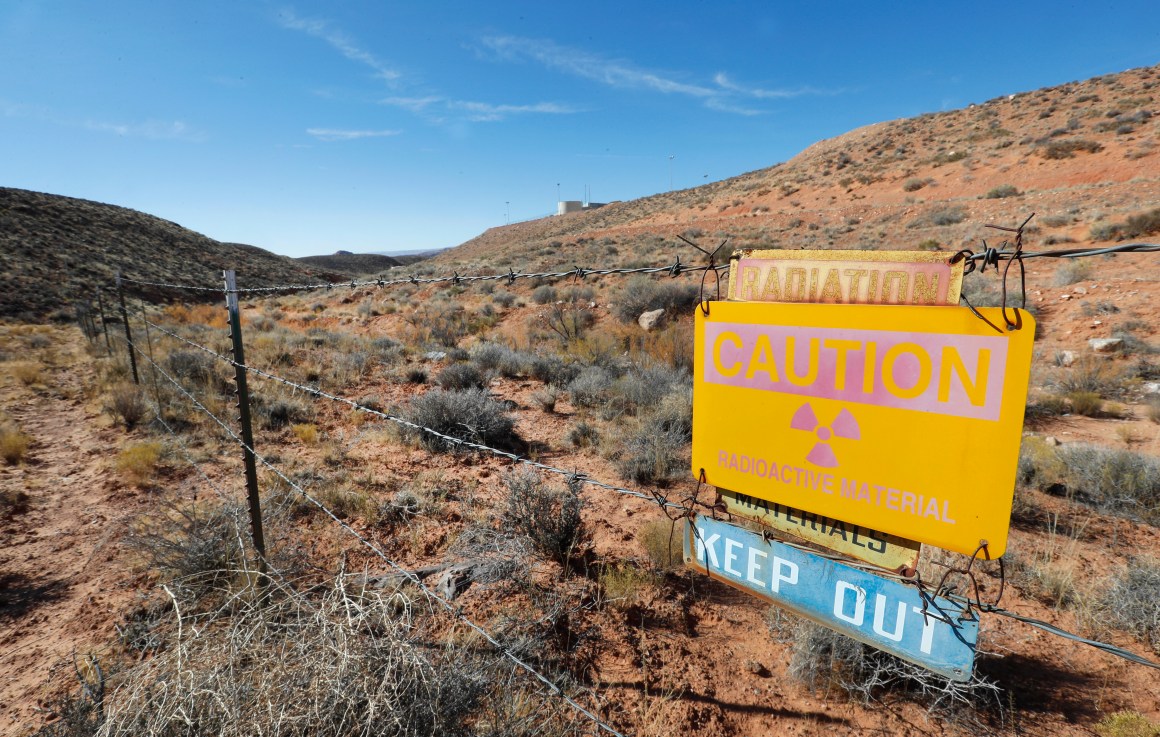 A radioactive warning sign hangs on fencing around the Anfield's Shootaring Canyon Uranium Mill on October 27th, 2017, outside Ticaboo, Utah.