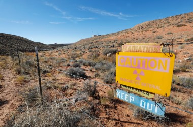 A radioactive warning sign hangs on fencing around the Anfield's Shootaring Canyon Uranium Mill on October 27th, 2017, outside Ticaboo, Utah.