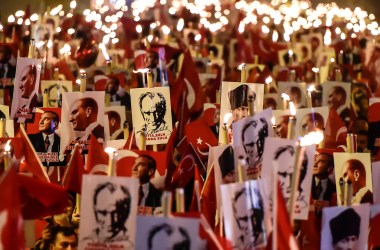 People hold torches and posters of Mustafa Kemal Ataturk, the founder of modern Turkey, during a march marking the 94th anniversary of Republic Day on October 29th, 2017, in Istanbul.