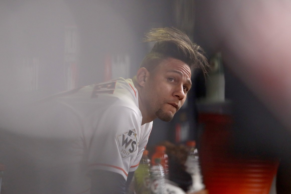 Yuli Gurriel looks on from the dugout during the fourth inning against the Los Angeles Dodgers in game five of the World Series at Minute Maid Park on October 29th, 2017, in Houston, Texas.