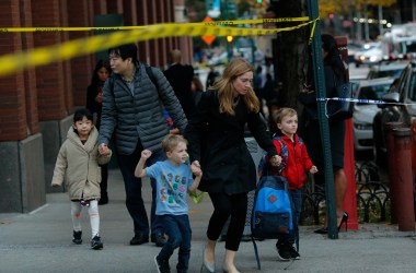 Children are evacuated from a school as emergency personal respond after a man driving a rental truck struck and killed eight people on a jogging and bike path in Lower Manhattan on October 31st, 2017, in New York City.