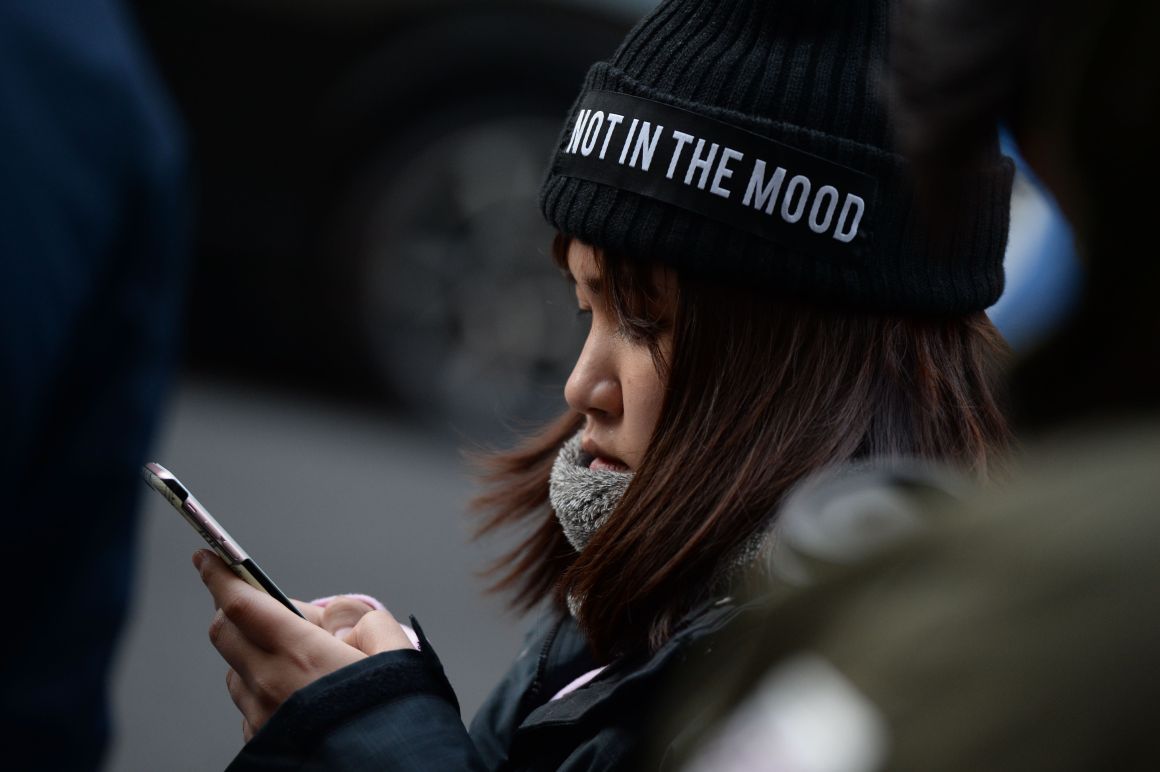 People wait outside Apple's Regent Street store in central London on November 3rd, 2017.