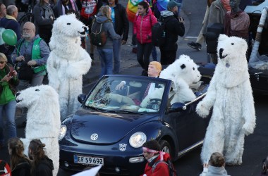 Climate change activists, including one dressed as U.S. President Donald Trump, march to demonstrate against coal energy on November 4th, 2017, in Bonn, Germany.