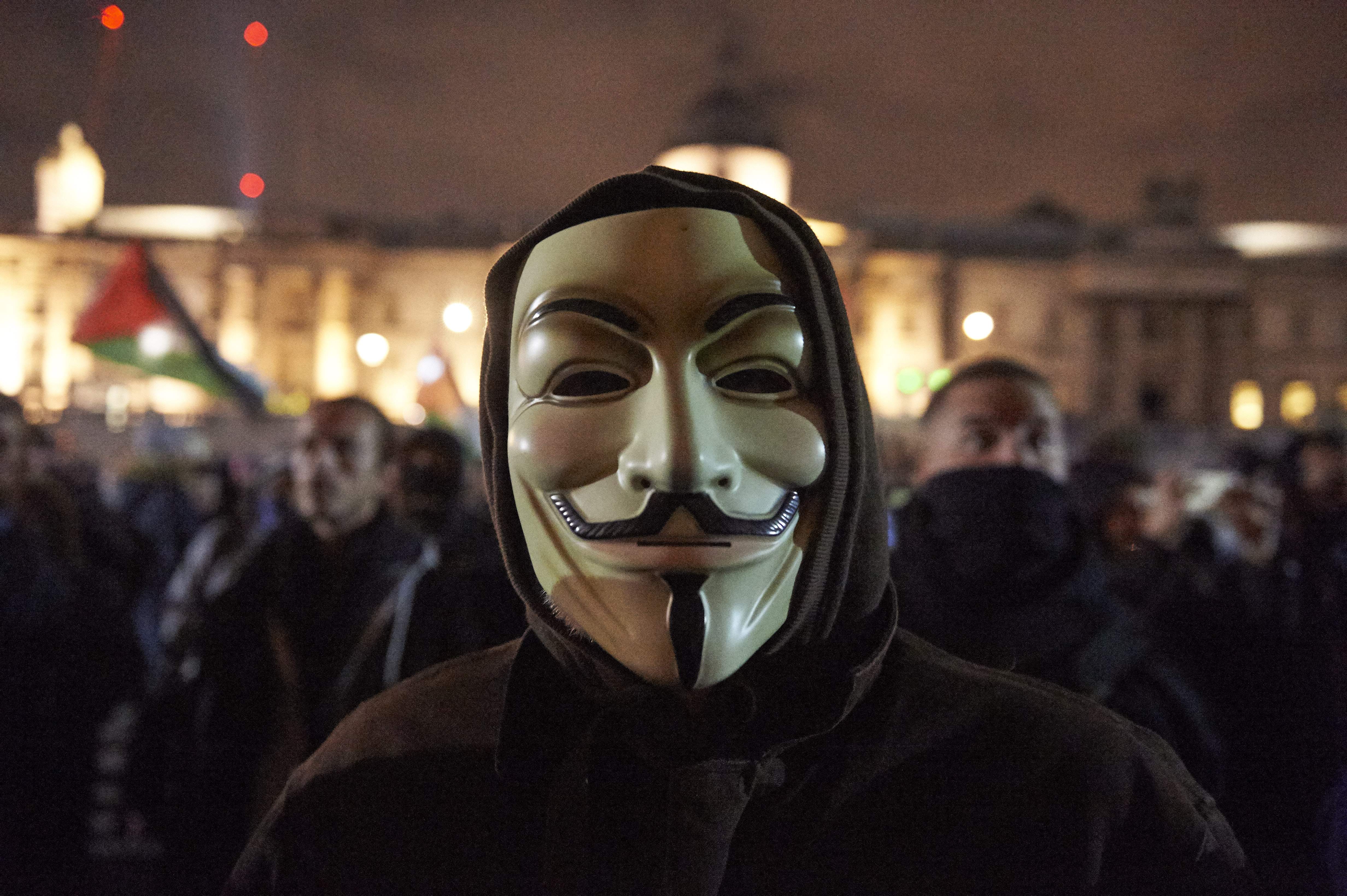 A man pictured here in London, England, wears the iconography of the Anonymous movement, on November 5th, 2017.