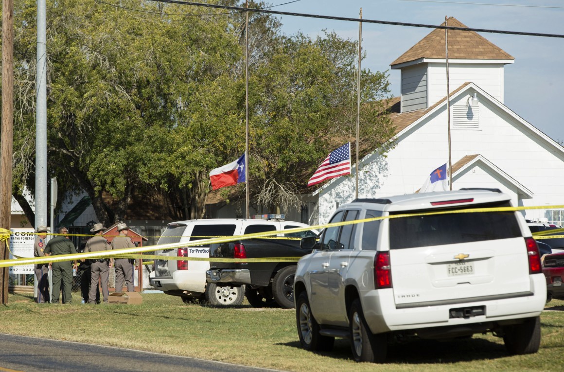 Law enforcement officials gather near the First Baptist Church following a shooting on November 5th, 2017, in Sutherland Springs, Texas