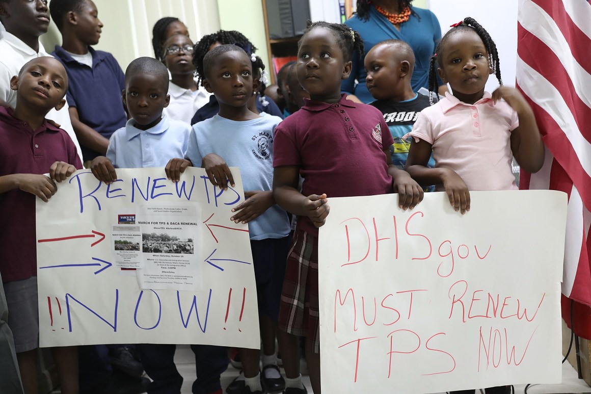 Children hold posters asking the federal government to renew Temporary Protected Status during a press conference about TPS for people from Haiti, Honduras, Nicaragua, and El Salvador at the office of the Haitian Women of Miami on November 6th, 2017, in Miami, Florida.