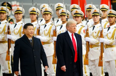 U.S. President Donald Trump takes part in a welcoming ceremony with China's President Xi Jinping.