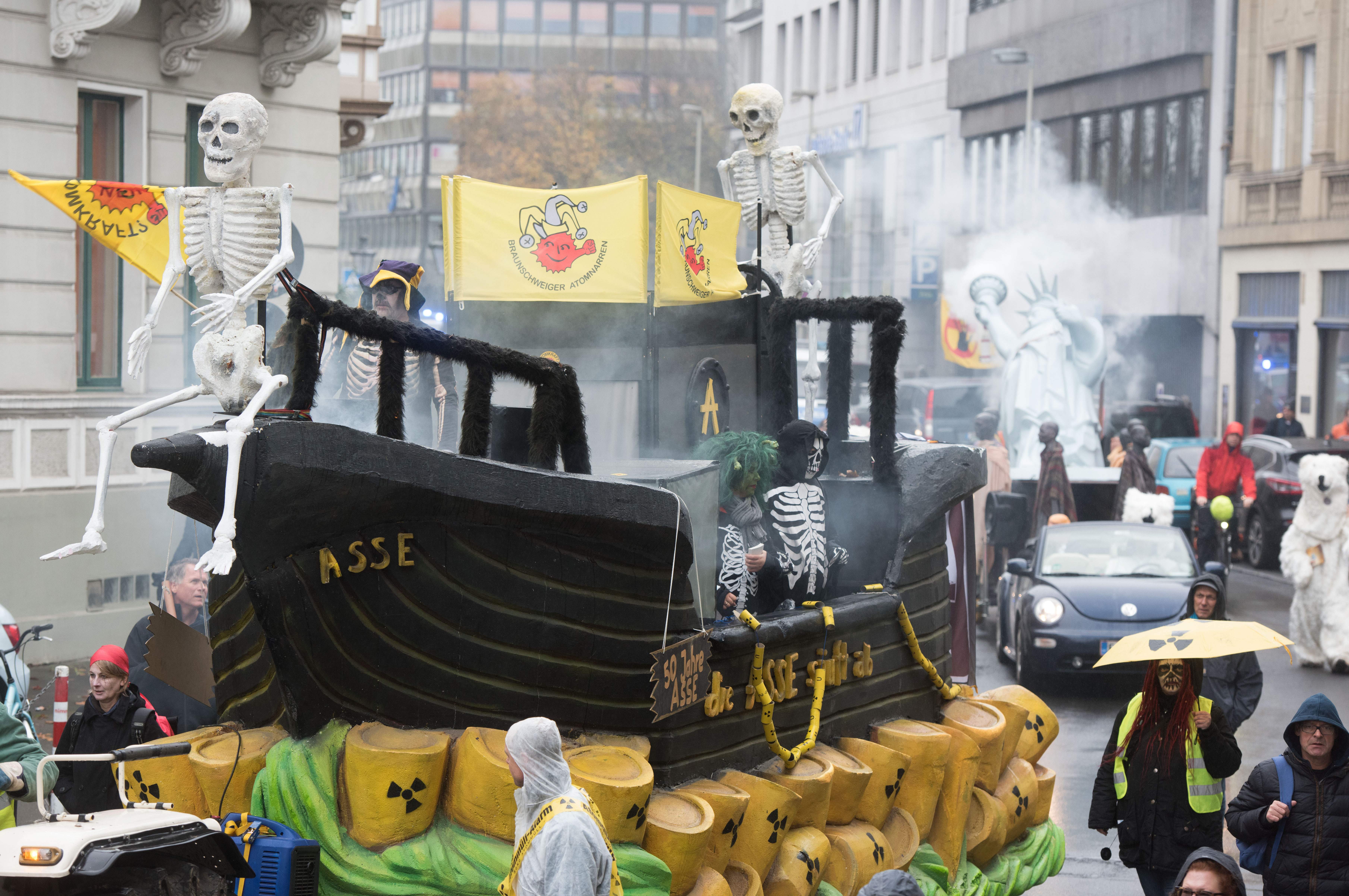 Demonstrators dressed as human skeletons stand on a float protesting nuclear waste on November 11th, 2017, in Bonn, Germany.