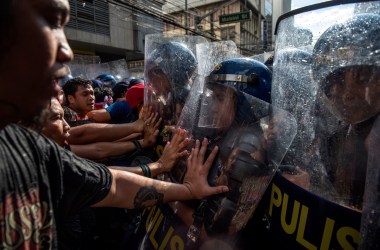 Protesters clash with riot police as they march in the streets of Manila on the day of President Donald Trump's arrival on November 12th, 2017, in Manila, Philippines.