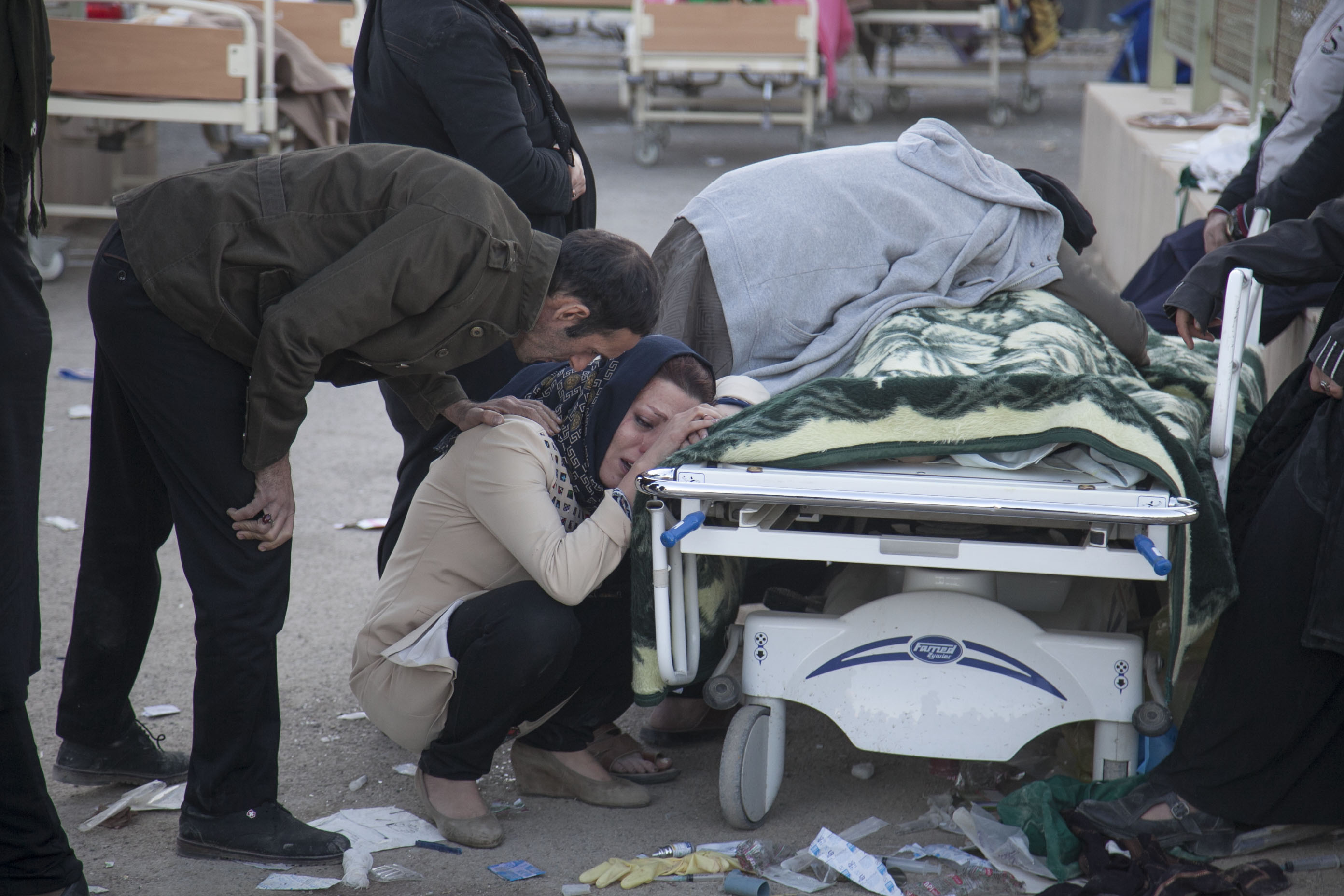 Iranians mourn over the body of an earthquake victim in Iran's western province of Kermanshah on November 13th, 2017.