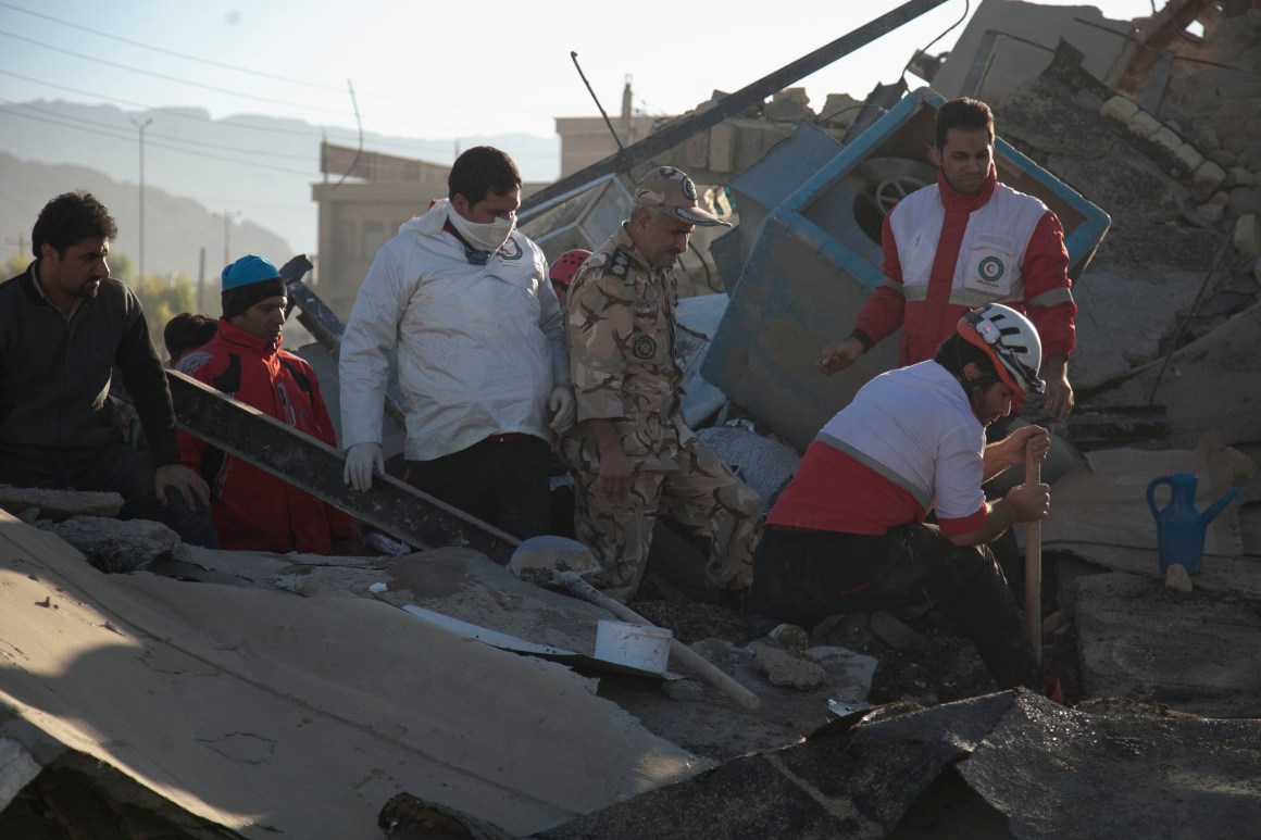 Rescue workers search for survivors amid the rubble following the earthquake in Sarpol-e Zahab on November 13th, 2017.