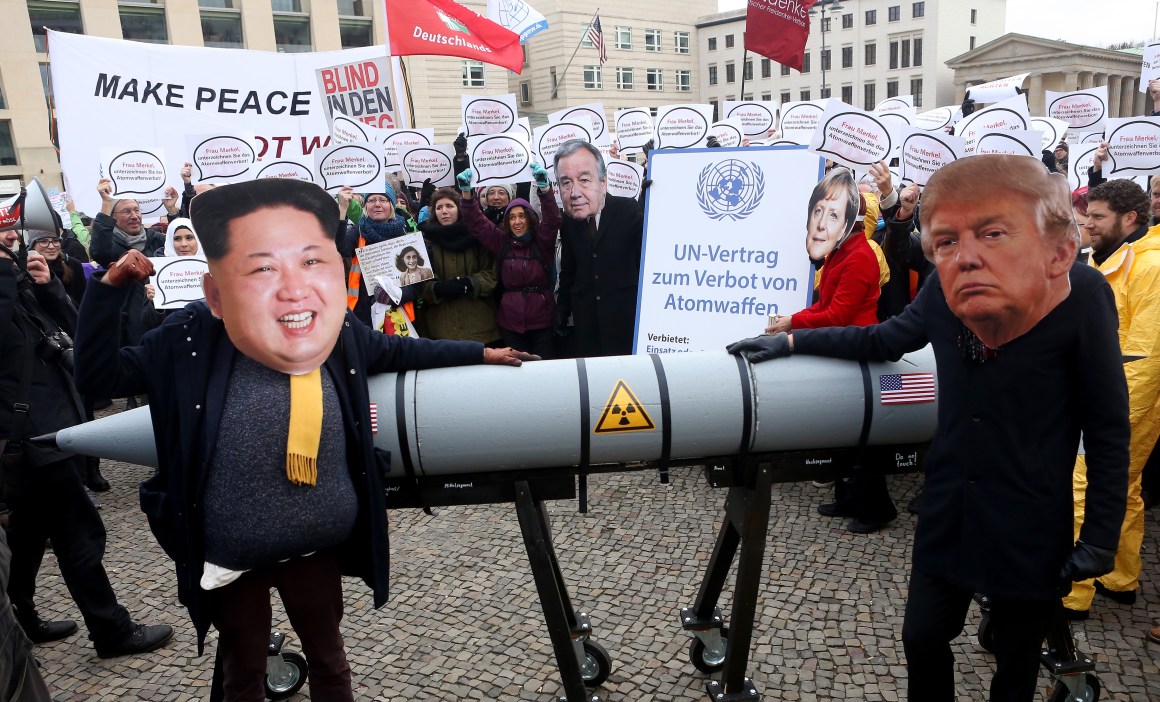 Activists dressed as North Korean leader Kim Jong-un and U.S. President Donald Trump march with a model of a nuclear rocket during a demonstration against nuclear weapons in Berlin on November 18th, 2017.