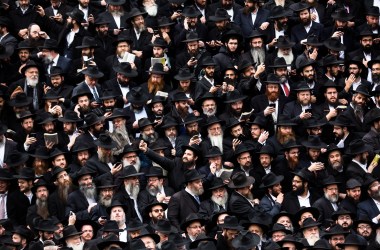 Hasidic Rabbis prepare to pose for a group photo on November 19th, 2017, during the annual International Conference of Chabad-Lubavitch Emissaries, in front of Chabad Lubavitch World Headquarters, in the Crown Heights neighborhood of Brooklyn.