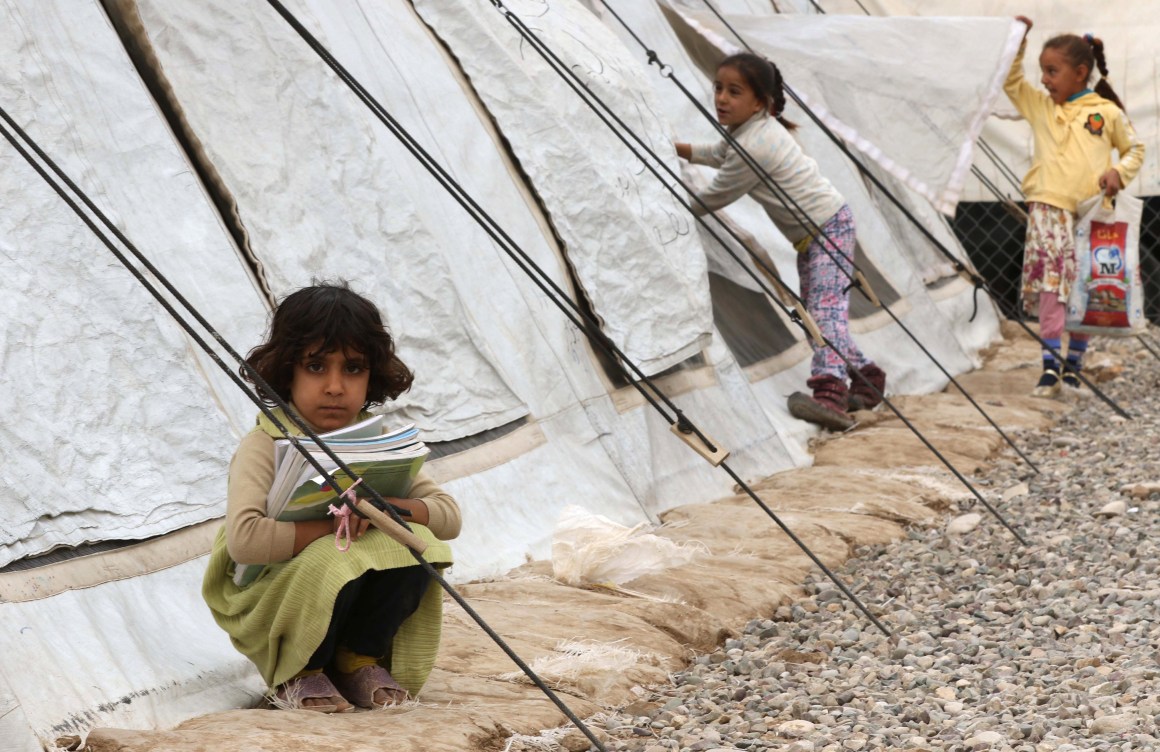 Displaced Iraqi children from the former embattled city of Mosul attend school at the Hasan Sham camp, east of Erbil in northern Iraq, on November 20th, 2017. Iraq's second city, Mosul was recaptured in July after being taken in a summer 2014 offensive by the Islamic State group.