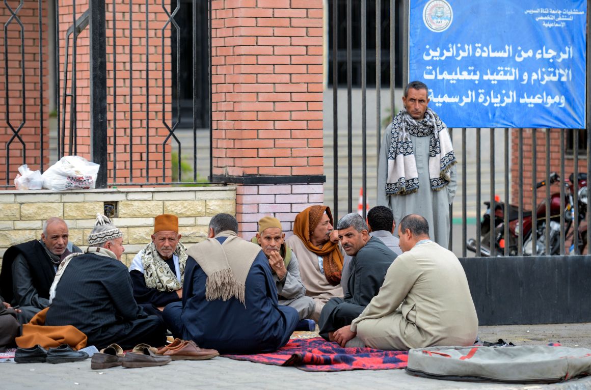 Relatives of the victims of the bomb and gun assault on the North Sinai Rawda mosque wait outside the Suez Canal University hospital in the eastern port city of Ismailia on November 25th, 2017.