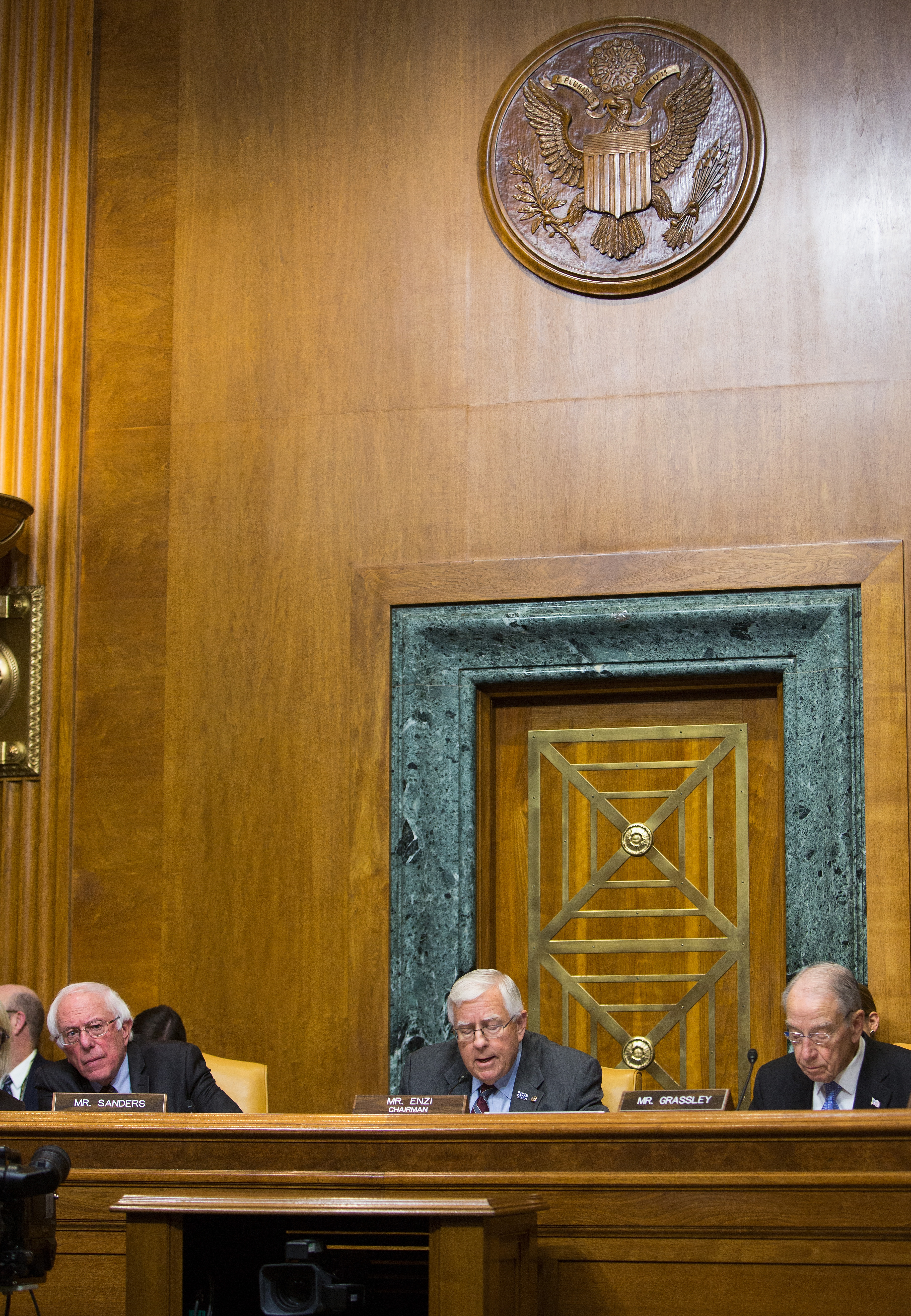 Senator Bernie Sanders (I-Vermont), Senate Budget Committee Chairman Mike Enzi (R-Wyoming), and Senator Chuck Grassley (R-Iowa) attend the full committee mark-up of the tax reform legislation on November 28th, 2017.