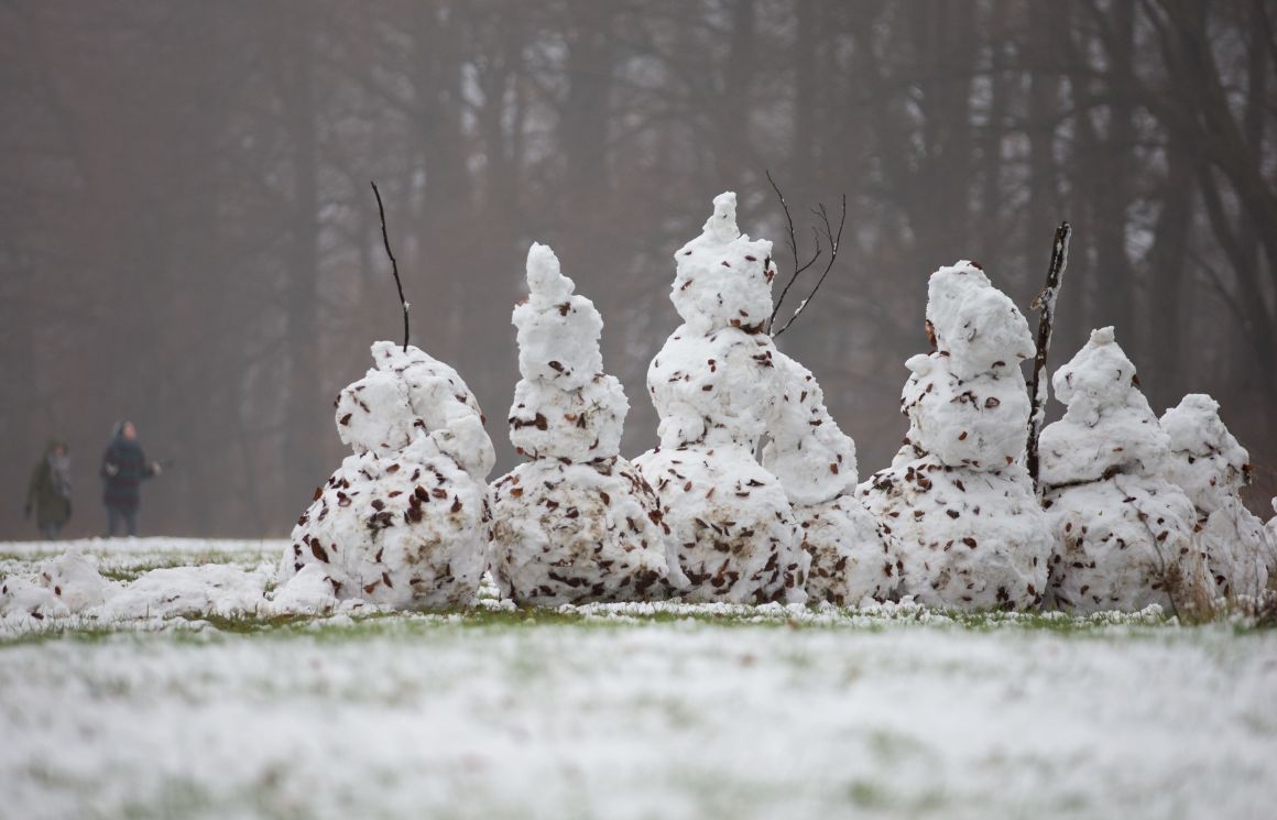 Snowmen stand on a field in Bielefeld, northwestern Germany.